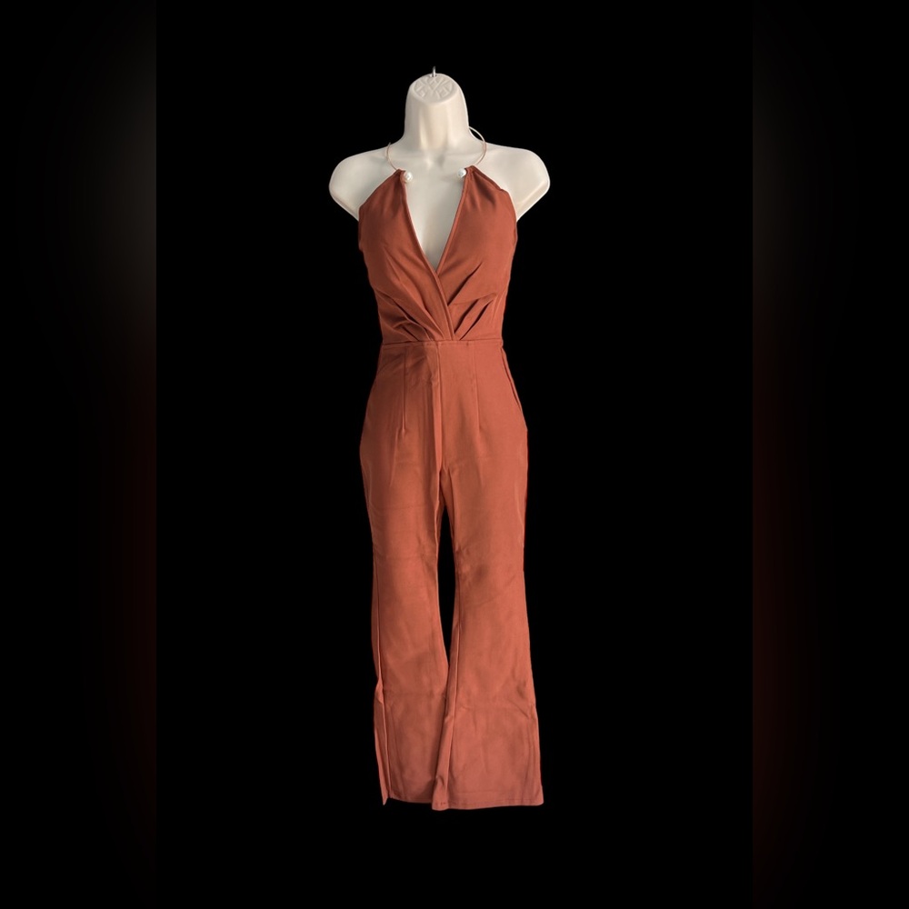 Jumpsuits Bust 34" Length 16"
Waist 28" Hip 38"